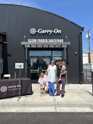 Bauer family stands outside of Carry On location