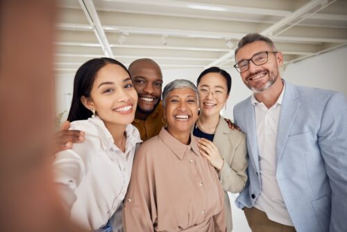 happy work team poses for a photo