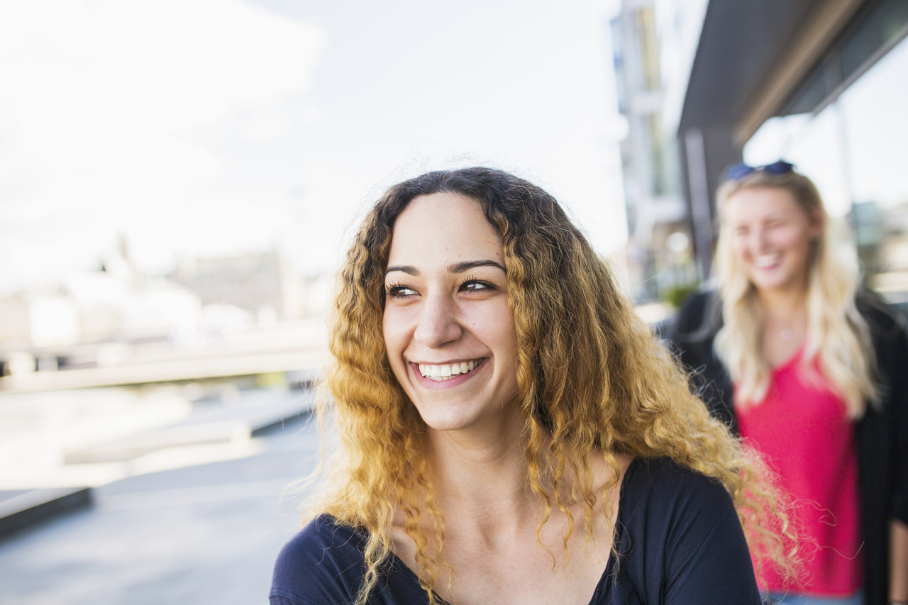 A young woman smiling